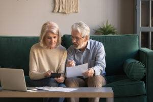 Serious mature couple checking domestic finances